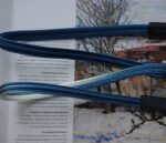 Close up of HOZUMA Blue Mt. Fuji Kumihimo silk camera strap showing braided texture, attached to a black Leica M11 camera.