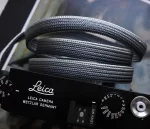 We have adopted the braiding technique known as Bamboo-gumi, which dates back to the Kamakura period and was primarily used for horse bridles (omogai). Its characteristic is that a variety of patterns can be created through different combinations of the braided cords. It's a flat, soft camera strap. The ring conection part is sewing with the leather，it is best to match the color you prefer with the leather you are making the Kumihimo with.