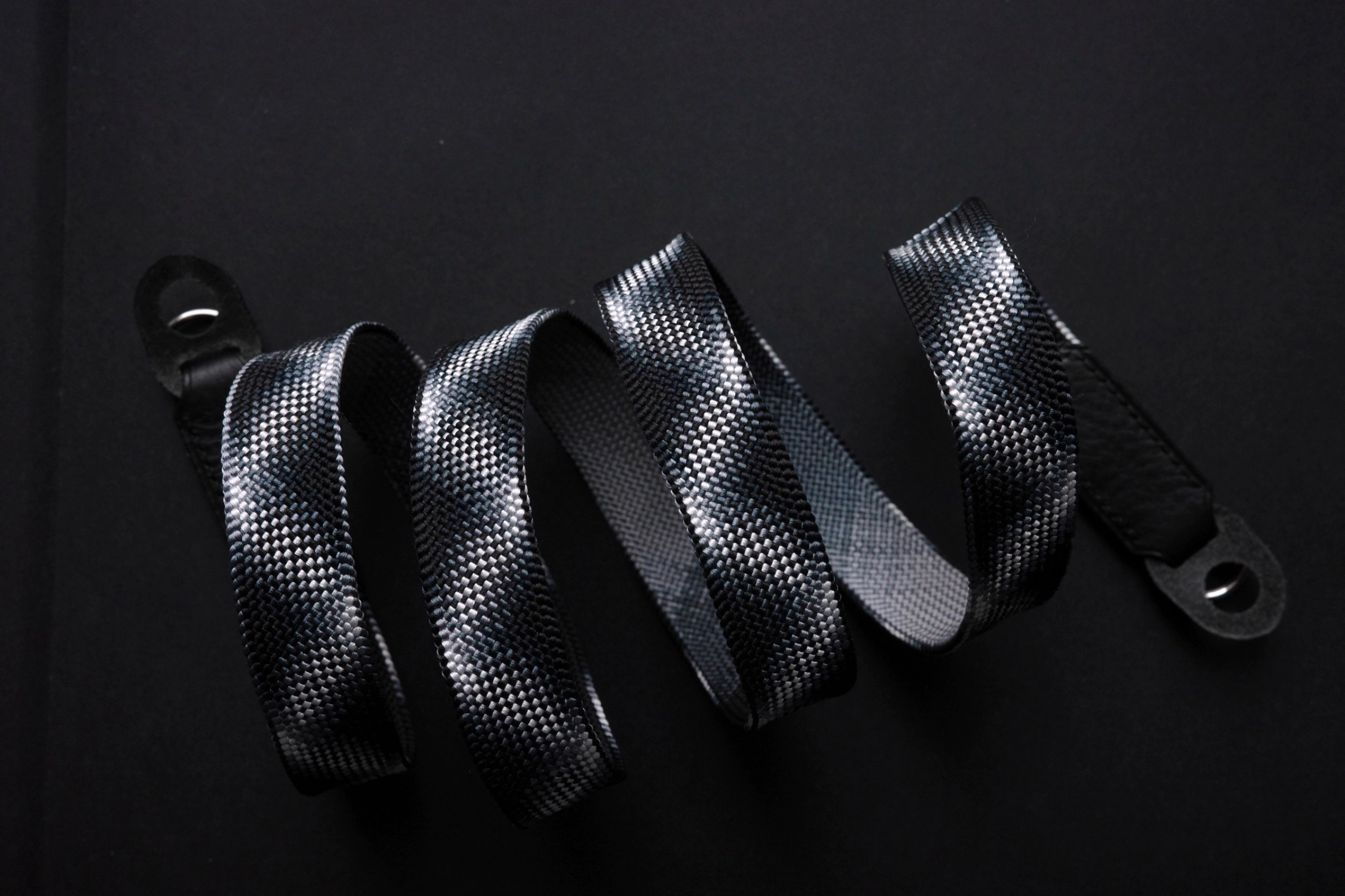 Discover the Black Samurai camera strap designed for Leica M11 Glossy Black Paint. Hand-braided using traditional Japanese Kumihimo, this premium strap blends craftsmanship, comfort, and timeless design inspired by samurai aesthetics.