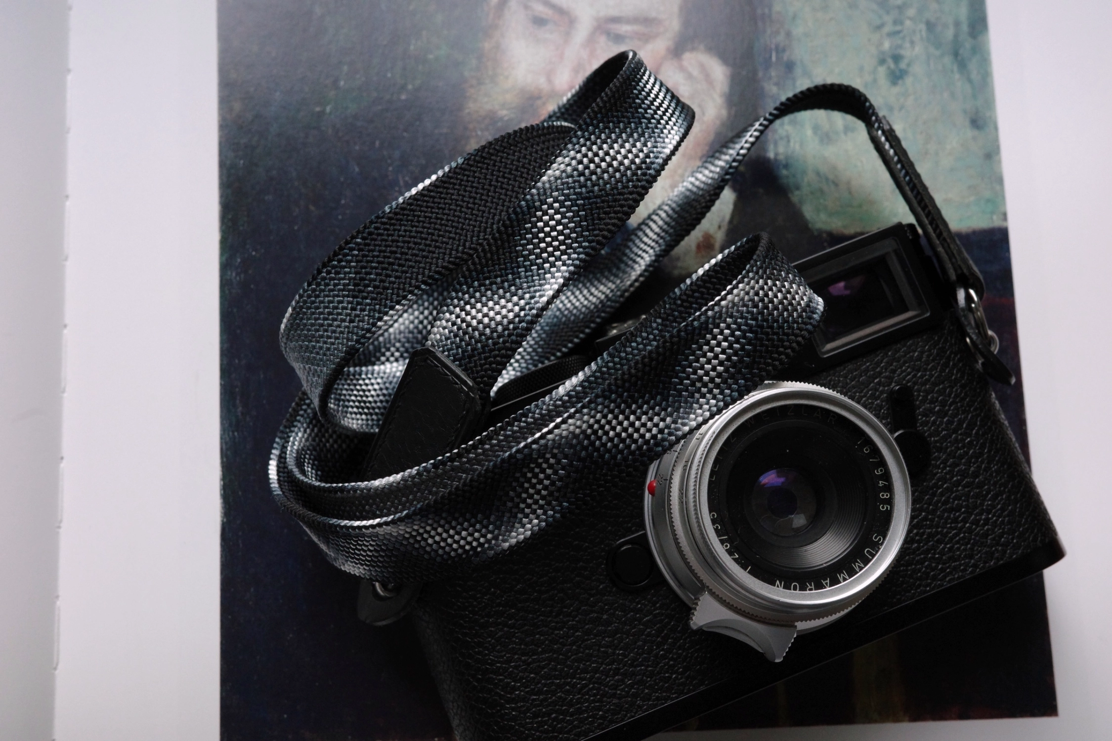 Discover the Black Samurai camera strap designed for Leica M11 Glossy Black Paint. Hand-braided using traditional Japanese Kumihimo, this premium strap blends craftsmanship, comfort, and timeless design inspired by samurai aesthetics.